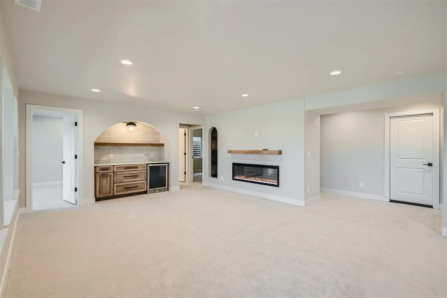 Finished basement family room by DG Home Pro, Colorado