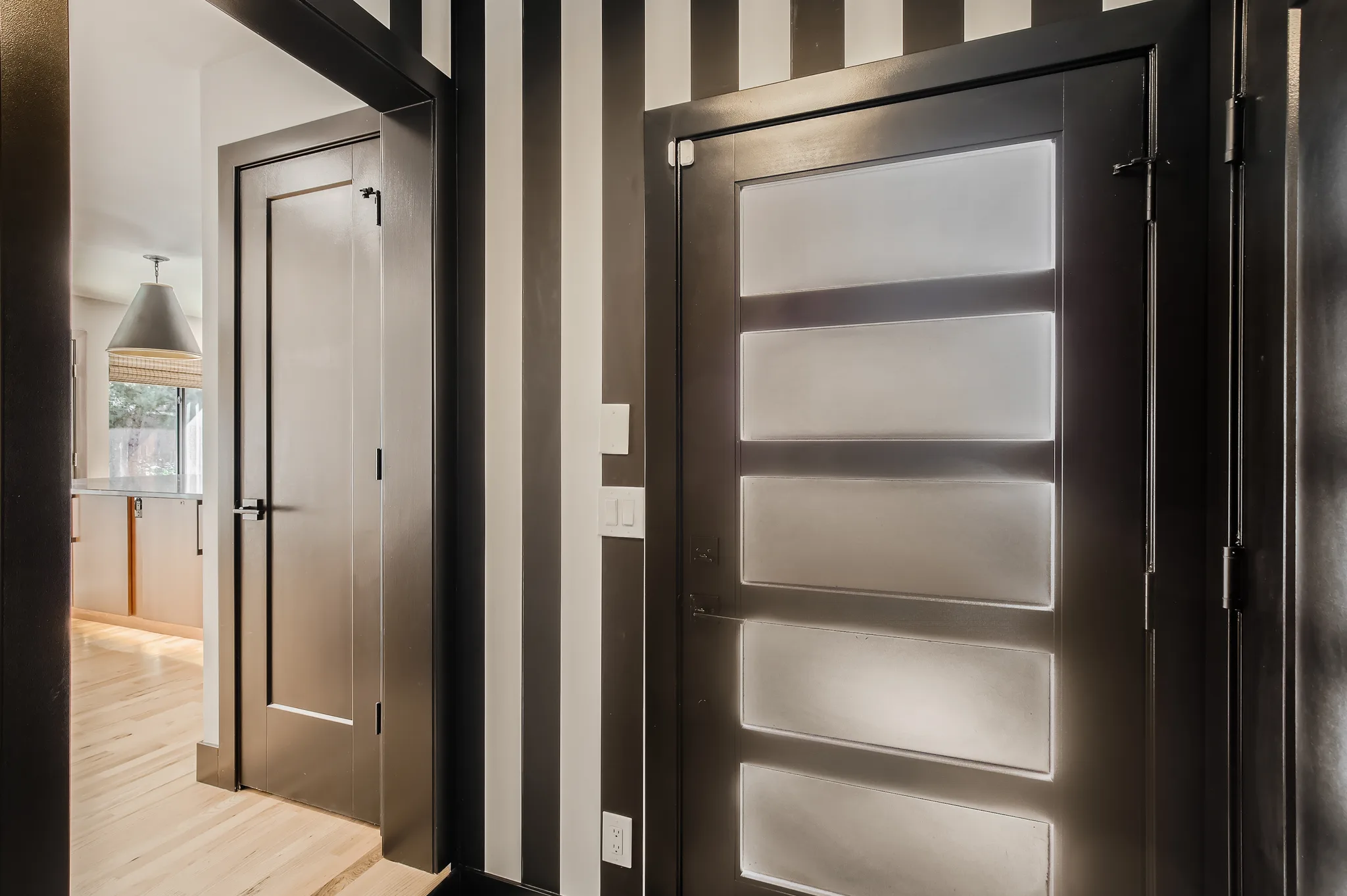 Custom foyer renovation adjacent to a Boulder kitchen remodel by DG Home Pro